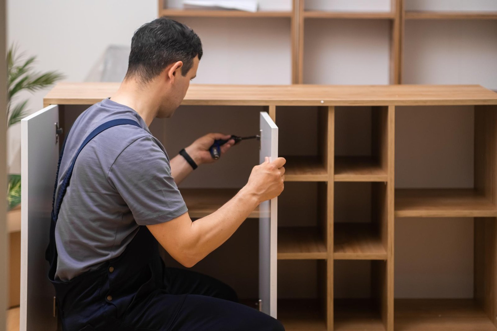 employee assembling furniture
