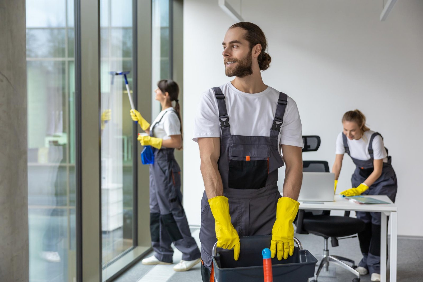 employees cleaning an office