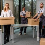 Delivery services. Group of people working in a delivery point